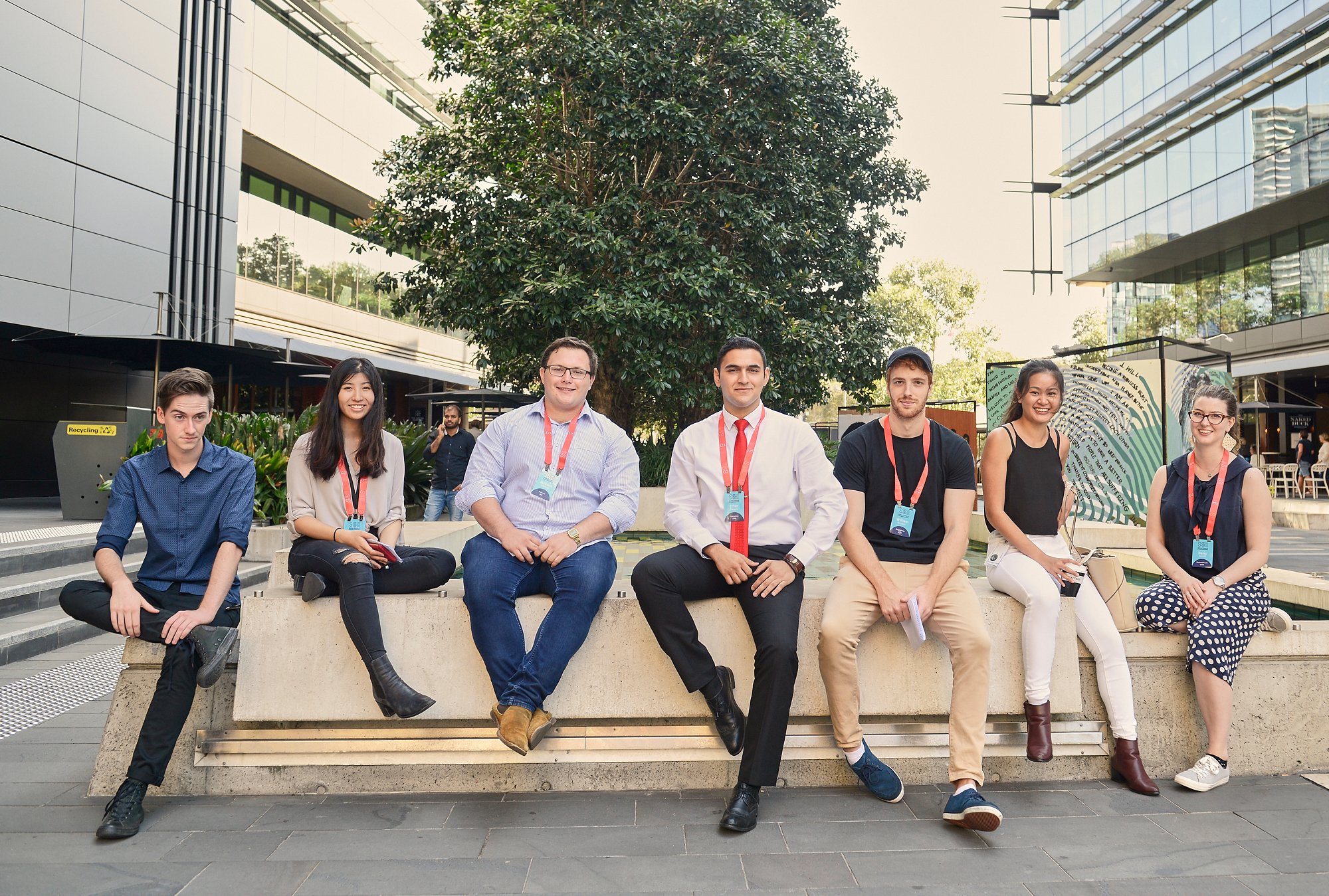 SSE MESH students sitting on a wall