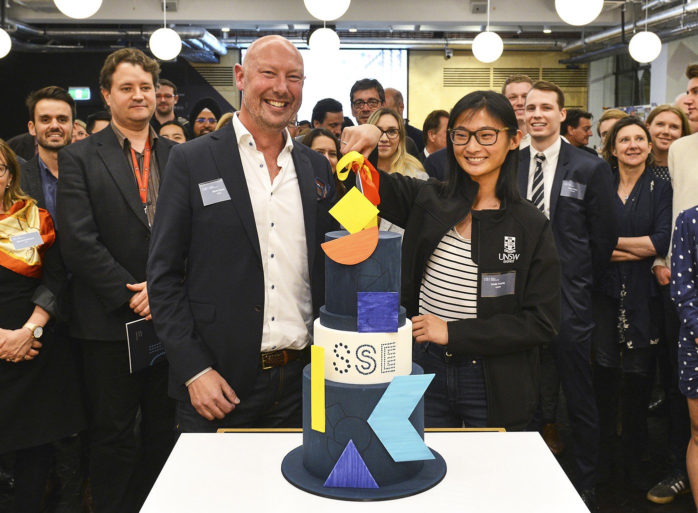 SSE CEO Nick Kaye and team with cake