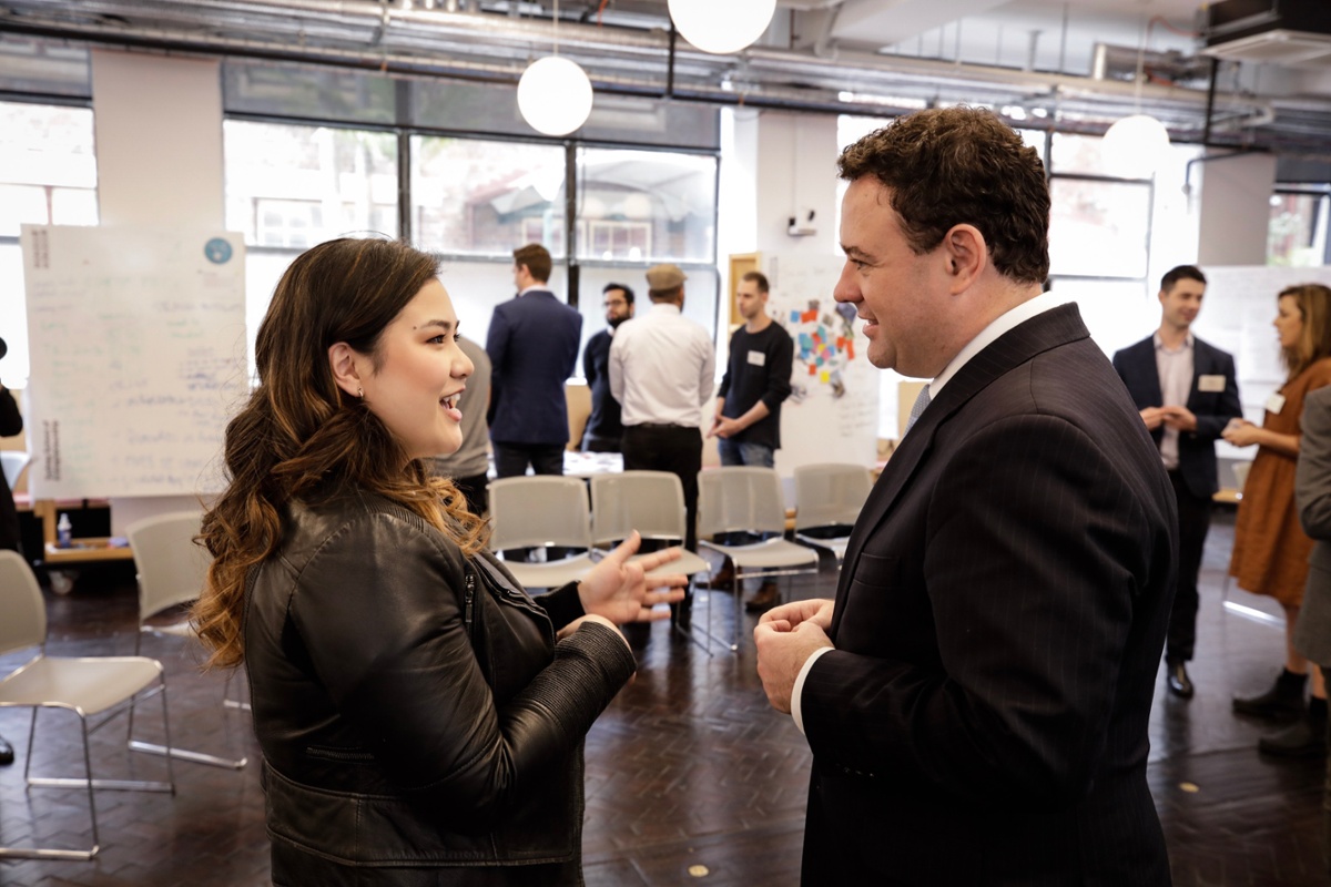 Student talking to minister